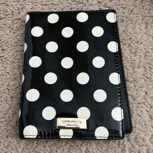 Never used, but signs of wear Kate Spade Carlisle Street Passport Holder